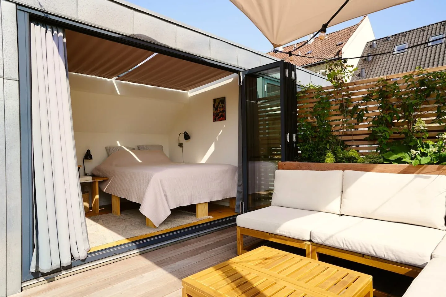 King bed with folding doors to the terrace